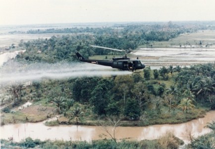 us-huey-helicopter-spraying-agent-orange-in-vietnam